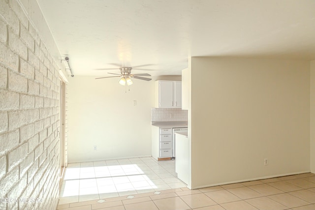 tiled empty room with ceiling fan