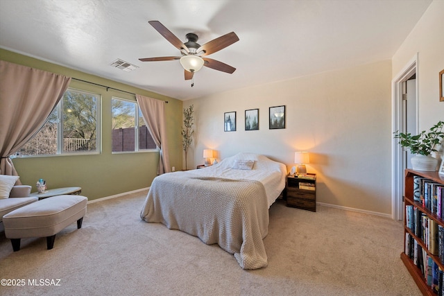 bedroom with light colored carpet and ceiling fan