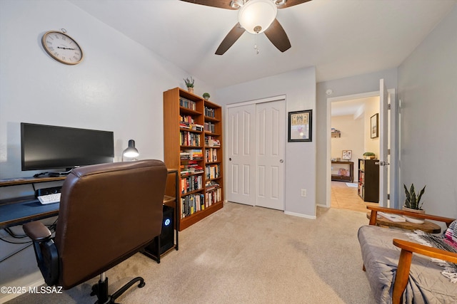 home office featuring ceiling fan and light colored carpet