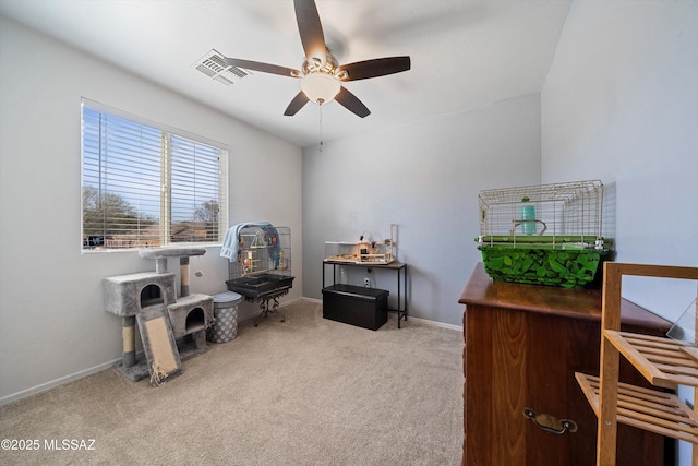 miscellaneous room featuring light carpet and ceiling fan