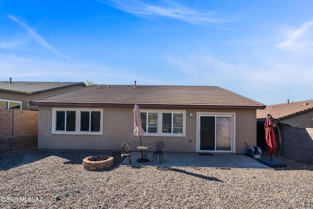 back of property with a patio