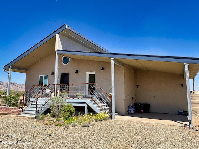 1155 N Dakotas Trl, Cochise, AZ 85606 - view of front of house with stucco siding, a mountain view, and stairway