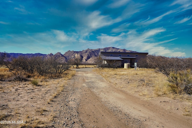 view of street featuring a rural view and a mountain view