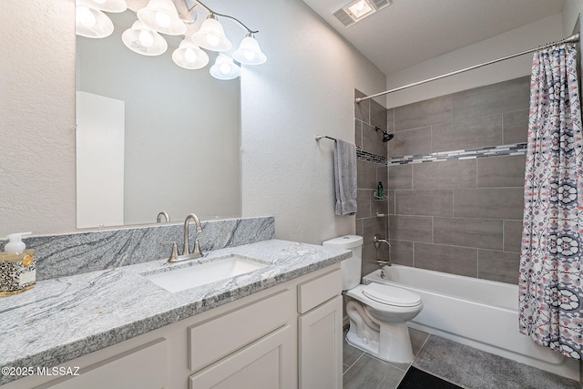 full bathroom with shower / tub combo with curtain, vanity, toilet, tile patterned floors, and an inviting chandelier