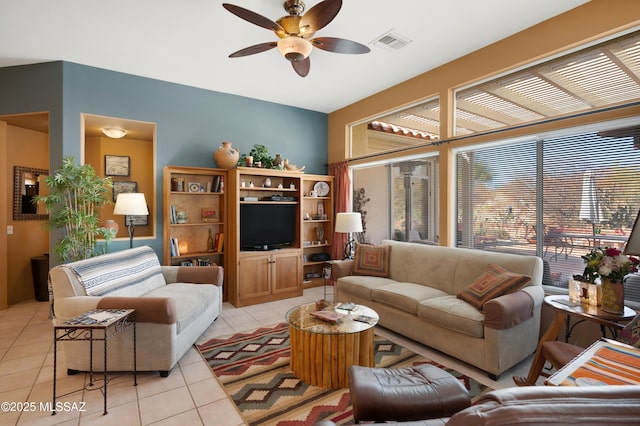 living room featuring ceiling fan and light tile patterned floors