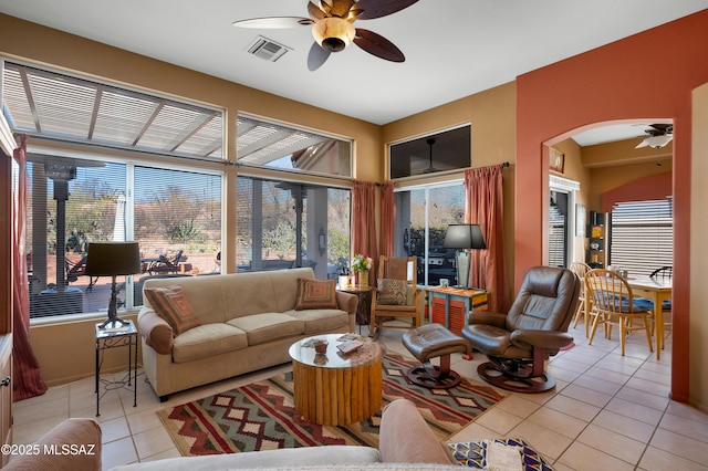 living room featuring light tile patterned flooring and ceiling fan