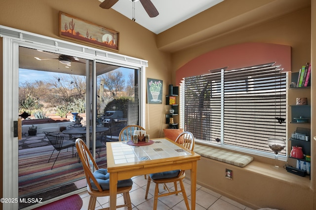 tiled dining area featuring ceiling fan