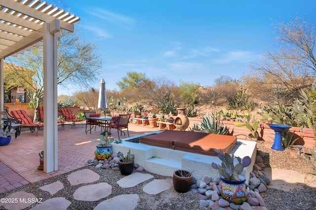 view of patio featuring a hot tub and a pergola