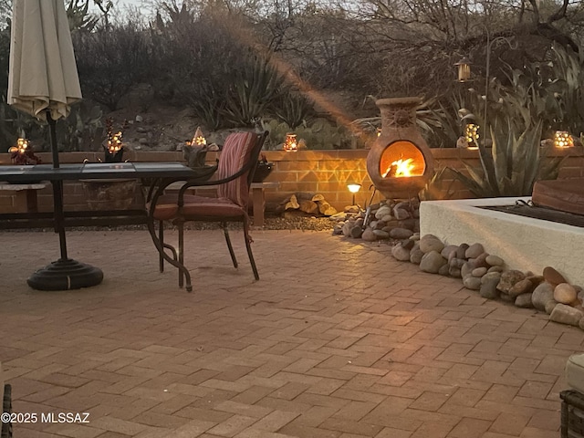 view of patio featuring an outdoor fireplace