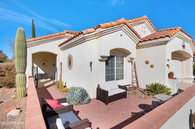 exterior space featuring a garage and a patio area