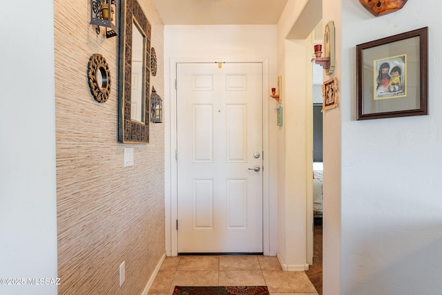 hall featuring light tile patterned flooring