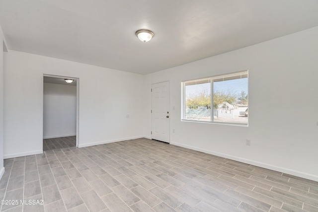 unfurnished room with light hardwood / wood-style floors