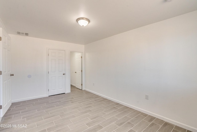 unfurnished room featuring light hardwood / wood-style floors