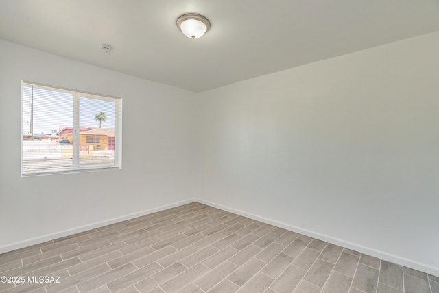 spare room with light hardwood / wood-style floors