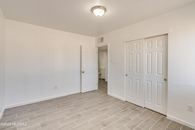 unfurnished bedroom featuring a closet