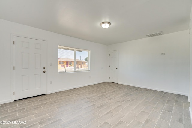 unfurnished room featuring light hardwood / wood-style flooring