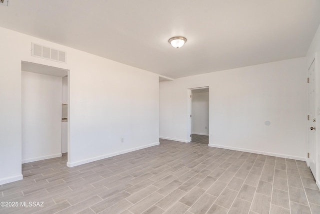 unfurnished room featuring light hardwood / wood-style floors