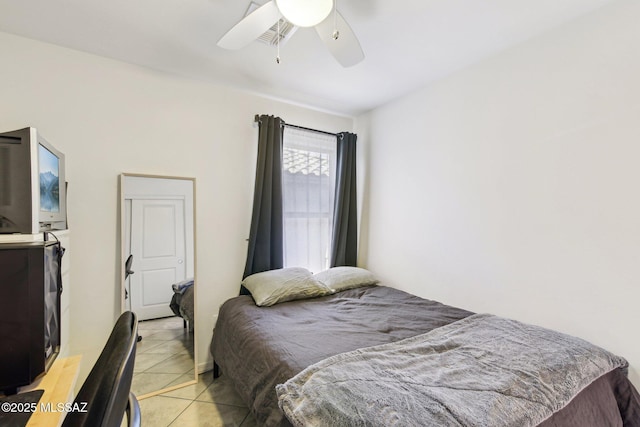 bedroom with light tile patterned floors and a ceiling fan