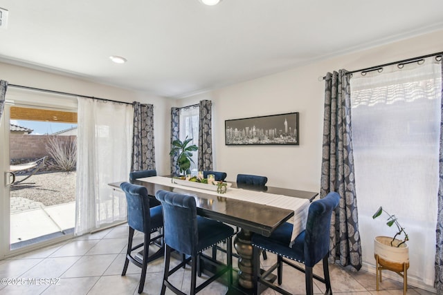 dining area with visible vents, plenty of natural light, and light tile patterned floors