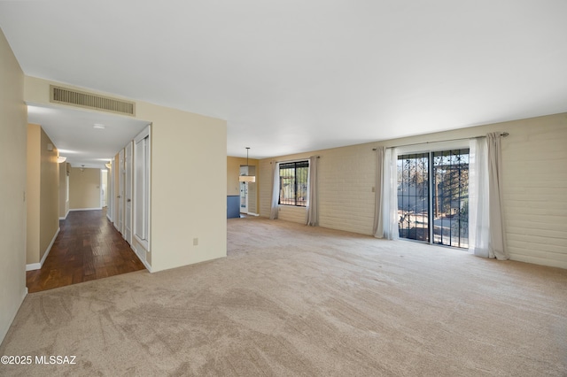 unfurnished room with carpet floors