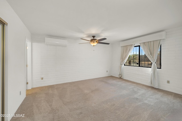 spare room featuring brick wall, light carpet, a wall mounted AC, and ceiling fan