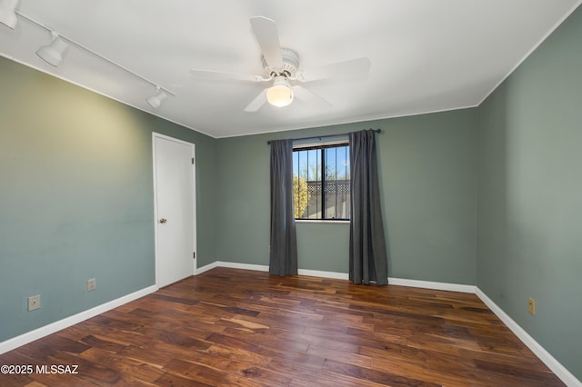 unfurnished room featuring dark hardwood / wood-style flooring and ceiling fan