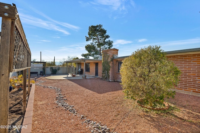 back of property with a patio