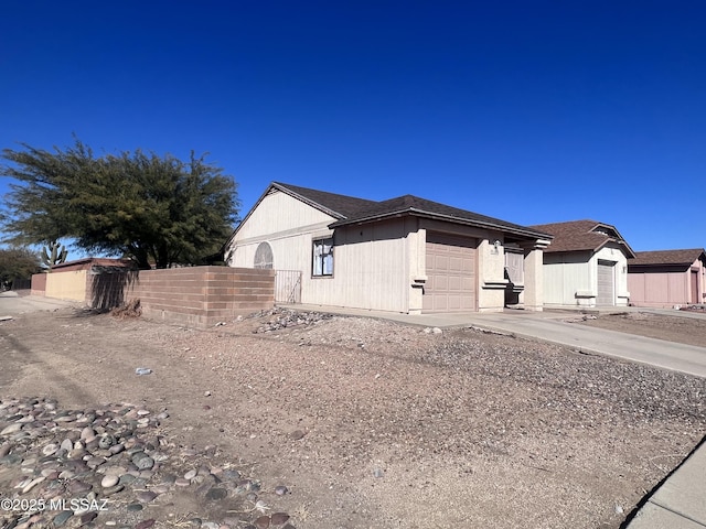 view of side of property featuring a garage