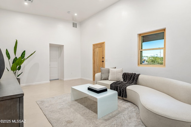 living room featuring a high ceiling