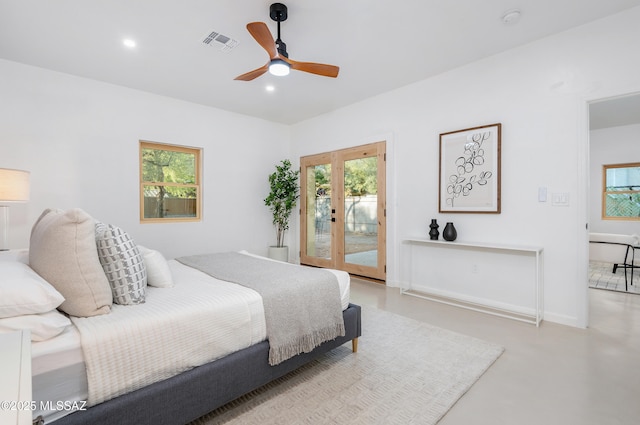 bedroom featuring multiple windows, access to exterior, ceiling fan, and french doors