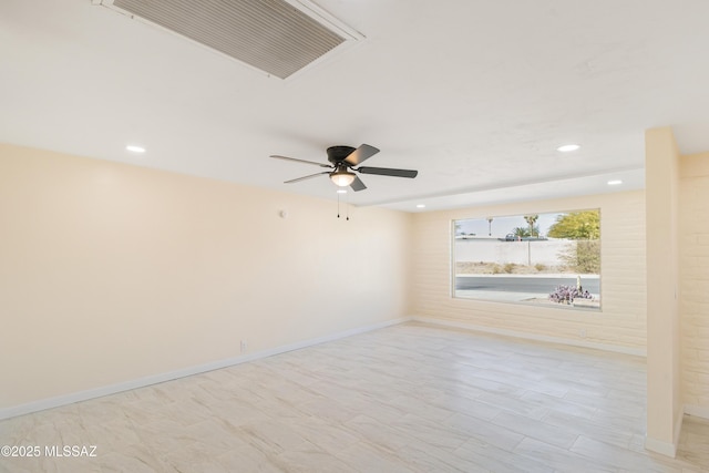 unfurnished room with ceiling fan