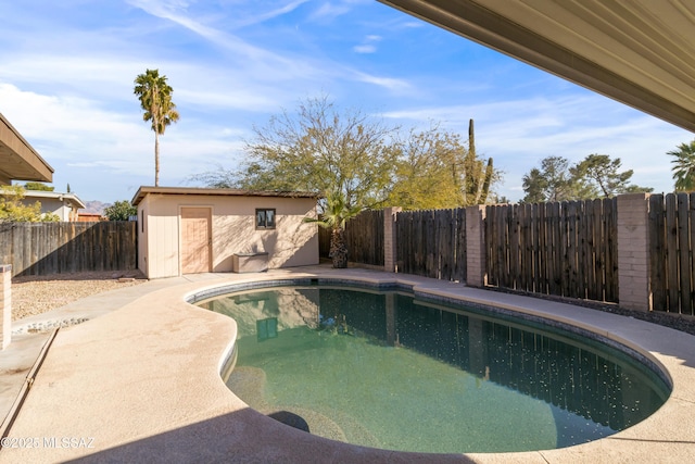 view of pool with a storage unit