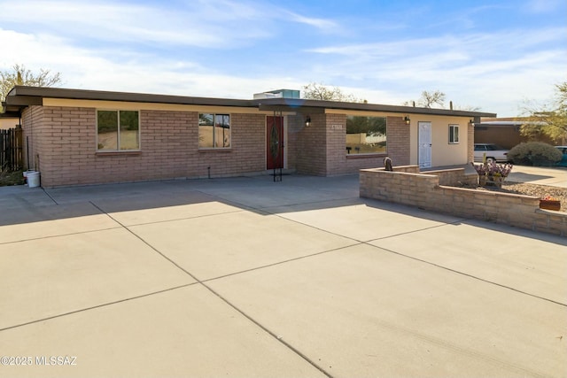 ranch-style home featuring a patio area