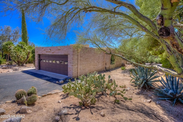 view of home's exterior with a garage