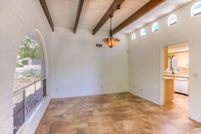 interior space with a wealth of natural light, wooden ceiling, and beam ceiling