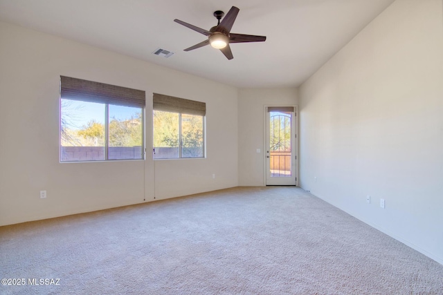 carpeted empty room featuring ceiling fan