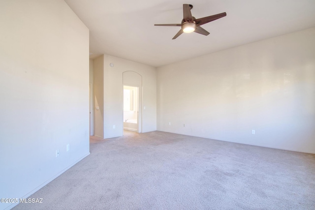 carpeted empty room featuring ceiling fan