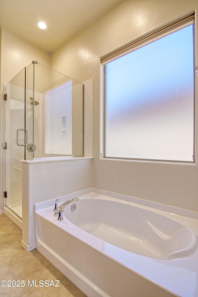 bathroom featuring independent shower and bath and tile patterned floors