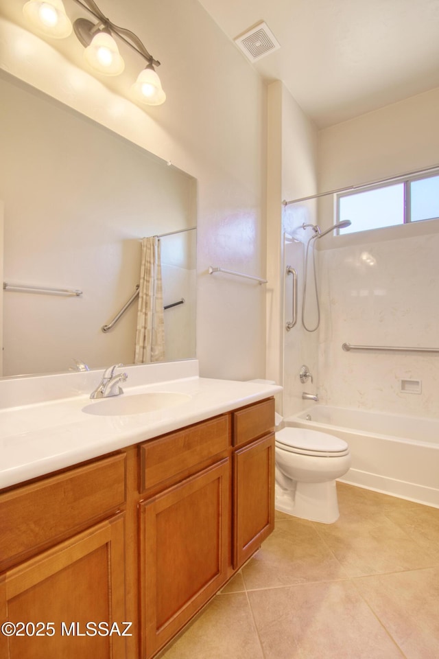 full bathroom with tile patterned flooring, vanity, shower / bath combo with shower curtain, and toilet