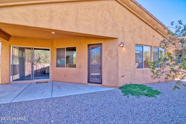 doorway to property featuring a patio