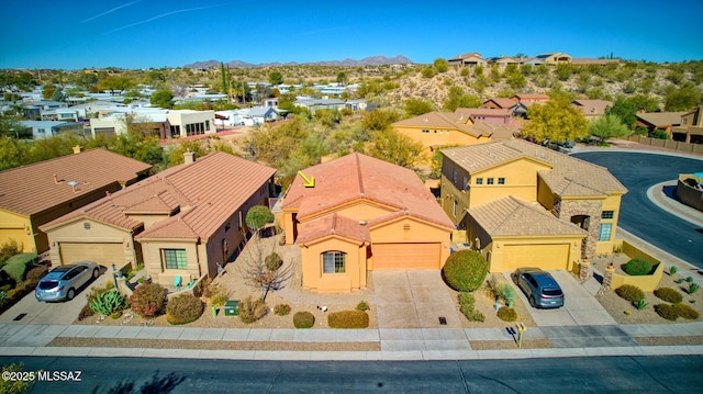 birds eye view of property with a mountain view