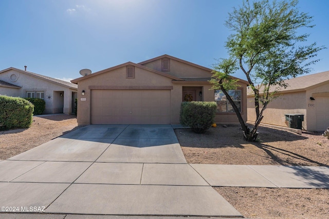 single story home featuring a garage