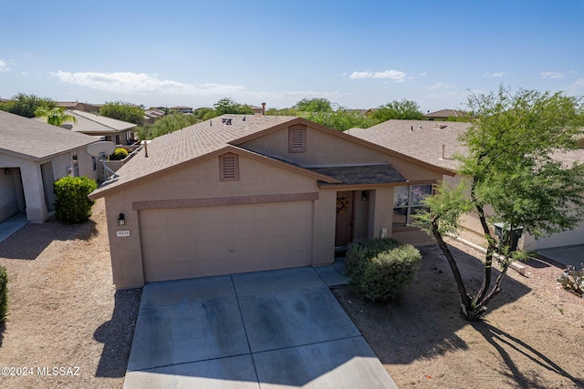 ranch-style home with a garage