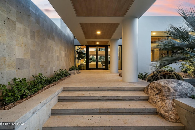 exterior entry at dusk with french doors