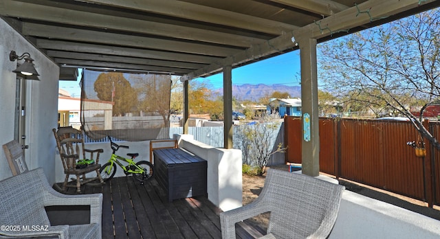 wooden deck featuring a mountain view