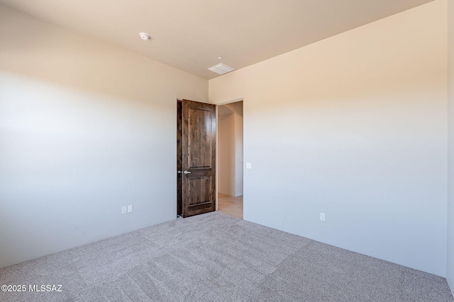 empty room featuring light carpet and visible vents