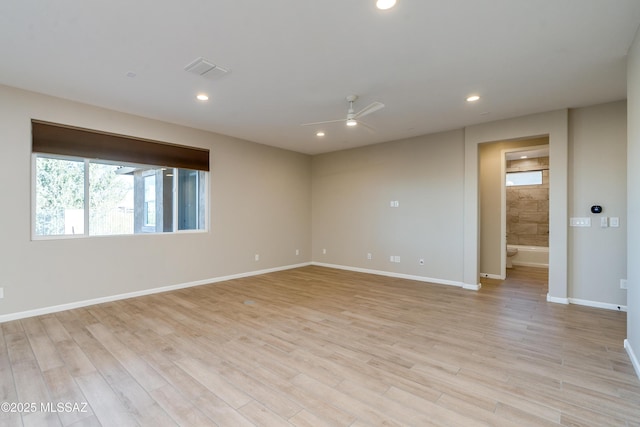 spare room with ceiling fan and light hardwood / wood-style flooring