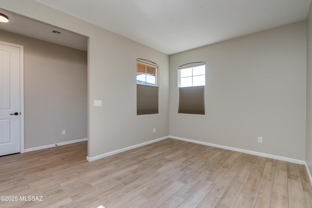 unfurnished room featuring light hardwood / wood-style flooring