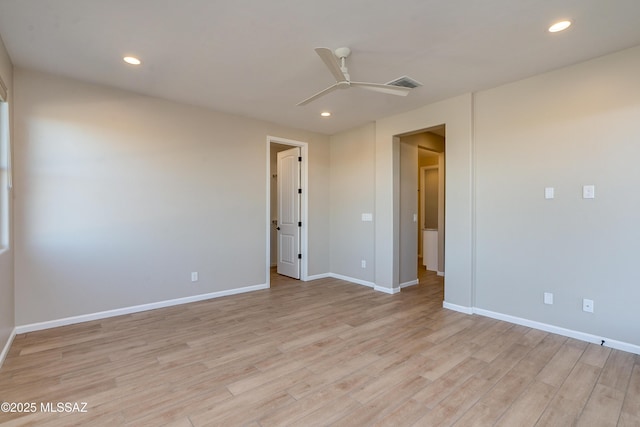 empty room with ceiling fan and light wood-type flooring