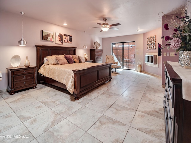 bedroom featuring access to exterior, ceiling fan, and light tile patterned flooring